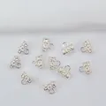 Detailansicht der 14k goldgefüllten Spacer-Perlen mit Blumenrelief für DIY-Schmuck - H60 Zylindrisch Silber