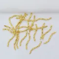 Macro shot of 14k gold-filled curved tube beads with textured engraving for DIY jewelry - 18K Gold