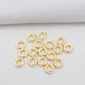 Macro detail of twisted 14k gold plated round spacer beads for DIY jewelry making - 4mm Outer Diameter / 14K Gold Plated