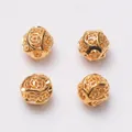 Vue rapprochée de quatre perles d'espacement creuses en or 24 carats pour bijoux DIY - Style creux de pièce de cuivre (R31) / Diamètre extérieur 8mm (10 pièces/paquet) / Or