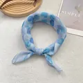 Detail of blue watercolor polka dot linen scarf on a minimalist wooden tray display - Polka Dot Blue