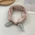 Retro geometric pattern cotton scarf displayed in a knot on a wooden tray - Small Beige Plaid