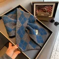 Detail shot of navy and charcoal argyle wool knit scarf with soft diamond pattern - Blue