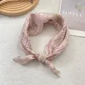 Detail of soft French floral silk scarf with pink vintage patterns on white texture - Creamy Beige Floral