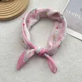 Pink floral cotton linen square scarf on white background with a minimalist magazine - Pink