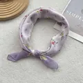 Detail of floral cotton linen neckerchief with purple flower pattern on white fabric background - Purple