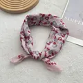 Detail of pink floral cotton linen scarf with fine stitched edges and soft texture - Pink