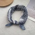 Detail shot of vintage pattern cotton linen small square neck scarf with bohemian floral prints - Blue