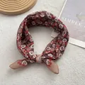 Detail shot of vintage floral cotton linen scarf with elegant rose patterns and hemmed edges - Chocolate Brown