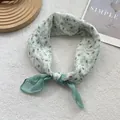 Close-up of cotton-linen small scarf featuring delicate tulip floral print and sea green patch - Small Flower Green
