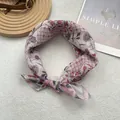 Close-up of vintage floral cotton linen square scarf with pink pattern and rolled edges - Pink Checkered Floral