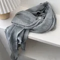 Detailed macro view of the grey cotton linen scarf texture and premium stitched edging - 230x57cm / Grey Blue