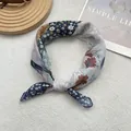 Close-up of floral plaid cotton linen scarf with breathable texture and knot detail - Ethnic