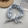 Close-up of blue floral print silk scarf showing delicate stitching and breathable fabric - White Cherry Leaf Small Lavender