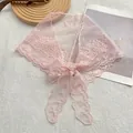 Detail of pink lace scarf featuring floral embroidery, mesh texture, and a delicate bow tie - Pink