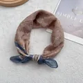 Retro floral cotton linen bandana in dusty pink with blue knot detailing on white fur - Coffee