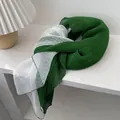 Detail of dark green and white pleated scarf with delicate polka dot texture - Green