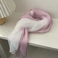 Close-up of pleated pink fabric and white polka dot lace on long lightweight scarf - Pink
