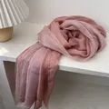Detail of soft pink pleated scarf with delicate crinkle texture on white display - 120x190cm / Grapefruit Pink