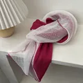 Detailed shot of two-tone pleated fabric scarf with polka dot mesh and wavy edges - Rose Red