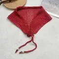 Detail of red crochet lace bandana scarf with mesh pattern and wooden bead tassels - Red