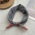 Vintage floral silk scarf in blue and pink tones placed on a soft white texture - 58cm x 58cm / Grey Blue Floral (1)