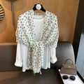 Detailed close-up of a white cotton scarf featuring green heart prints and tassel edges - 180*70cm / Green