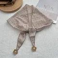 Floral triangle headscarf with scalloped edges and crochet flower charms on white fabric - Khaki
