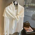 Detail of white cotton linen scarf with sparkling rhinestones and elegant knot styling - White