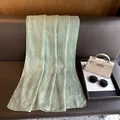 Detail of mint green scarf with vertical stripes and golden foil print on leather - 180x70cm / Green