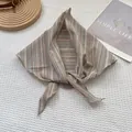 Retro striped triangular headscarf with wavy edges displayed on a waffle fabric background - 100*30cm / Off White