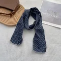 Close-up of vintage floral cotton linen scarf with white wave lace embroidery edges - Argyle Navy