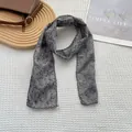 Close-up of floral cotton scarf with delicate black lace edges on a minimalist background - Floral Gray