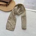 Detail of floral skinny scarf with dark red crochet wave edge on cotton linen fabric - Floral Khaki