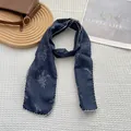 Close-up of floral navy blue cotton-linen scarf with white scalloped edge stitching - Navy Lavender