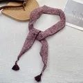 Detailed shot of floral narrow silk scarf with elegant tassels on waffle texture background - Deep Pink Purple Floral (3)