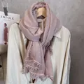Detail of light purple scarf featuring delicate lace pom-pom trim and breathable texture - Pale Green