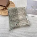 Elegant patchwork floral skinny scarf in bean green and cream white with delicate patterns - Green