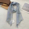 Detail of light blue striped silk scarf with floral patterns on a white background - 18cmx165cm / Azure Blue