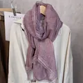 Detail of elegant dark purple linen scarf with intricate matching lace trim and soft texture - Purple