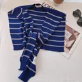 Detailed close-up of navy blue and cream striped knit shawl with high-quality fabric texture - Shawl / Striped Navy Blue