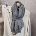 Close-up of grey cotton linen scarf with elegant bead lace trim and tassel details - 180x90cm / Light Gray