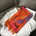 Bohemian orange floral scarf with red poppies and fringe tassels on a white shirt - 180x70cm