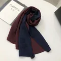 Detailed waffle texture of two-tone linen scarf with delicate handmade flower pendant - Navy Blue