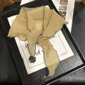 Detail of thin ginger yellow shawl scarf with wavy grey edges and black accents - 30x100 / Yellow