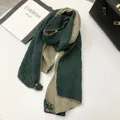Detail of green and khaki pleated scarf featuring delicate mini tassel ball charms - Dark Green