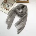 Detail of grey lace scarf with floral embroidery and elegant pearl bead embellishments - Gray