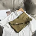 Close-up of yellow and green plaid cotton neck scarf with delicate ruffled edge detail - Olive Green