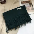 Close-up of 100% Australian wool scarf in forest green with soft tassels and label - 180*30cm / Turquoise Green