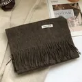 Close-up of 100% Australian wool scarf in dark brown with elegant tassel detail - 180*30cm / Cocoa Brown